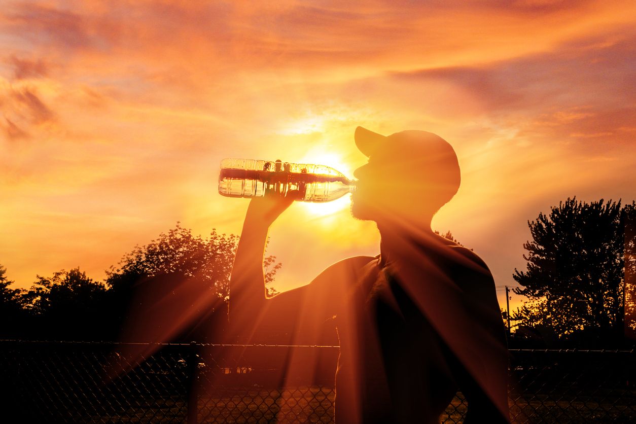 Heatwave person drink a bottle of water