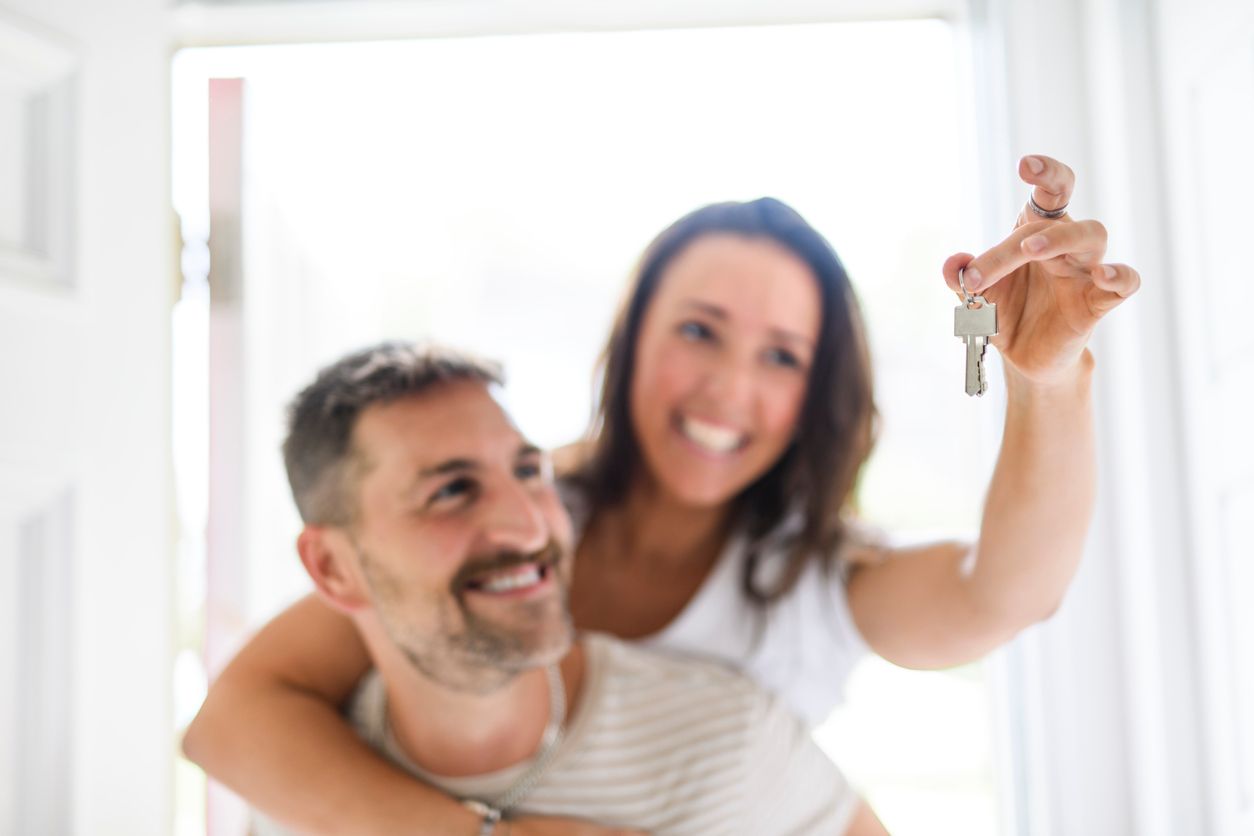 two people and the woman was holding the key